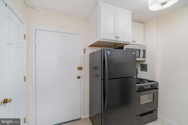 a kitchen with granite countertop a sink and a stove