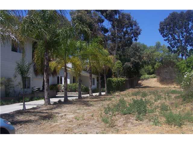 2350-23 Rancho Santa Fe And 8th Street Road Encinitas, CA 92024 - Photo 1 of 3 neighbor on the left has the palms....lot vacant--slight slope up toward end of lot