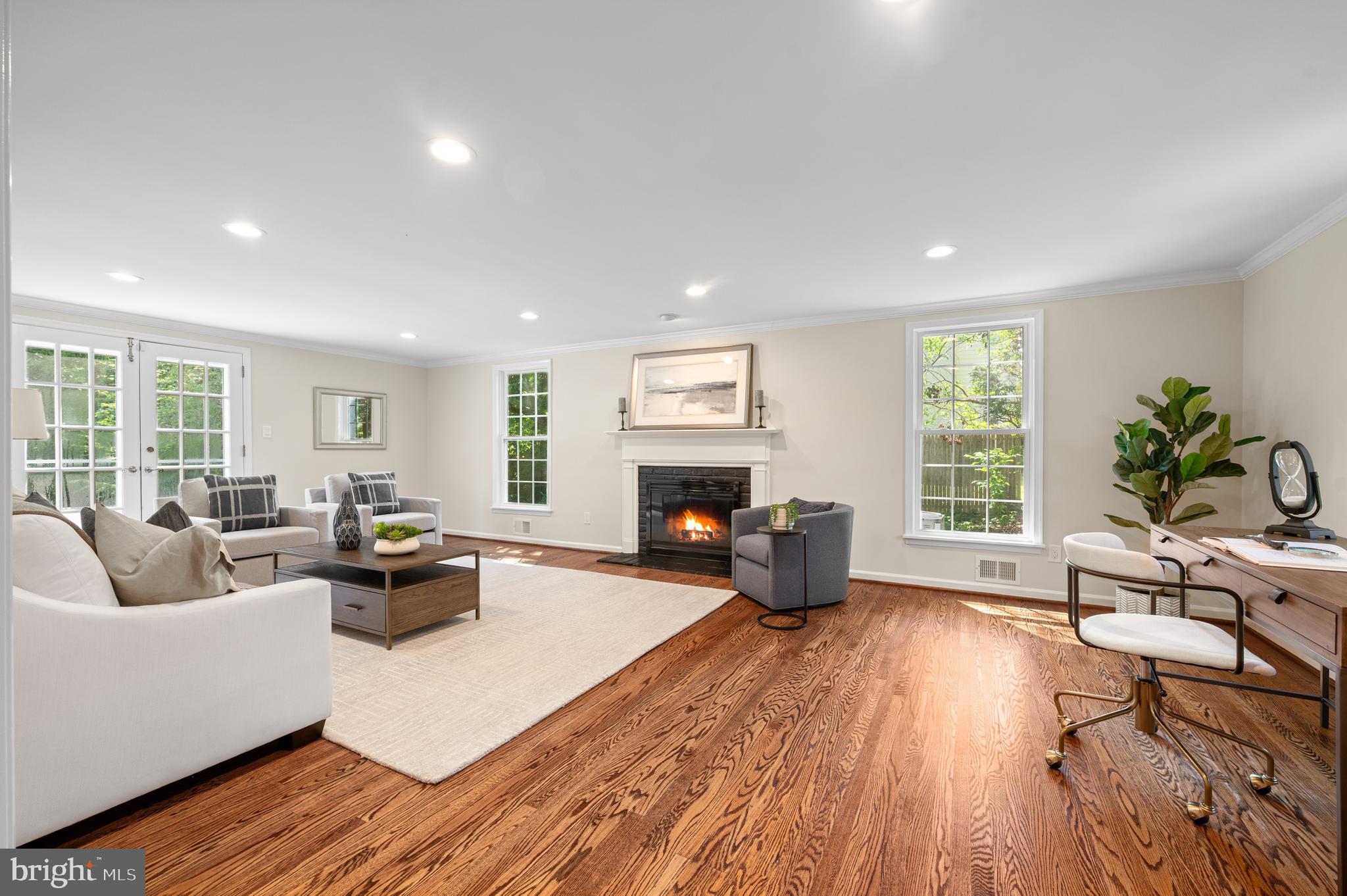 813 Malin Road Newtown Square, PA 19073 - Photo 16 of 55 a living room with furniture wooden floor and a fireplace