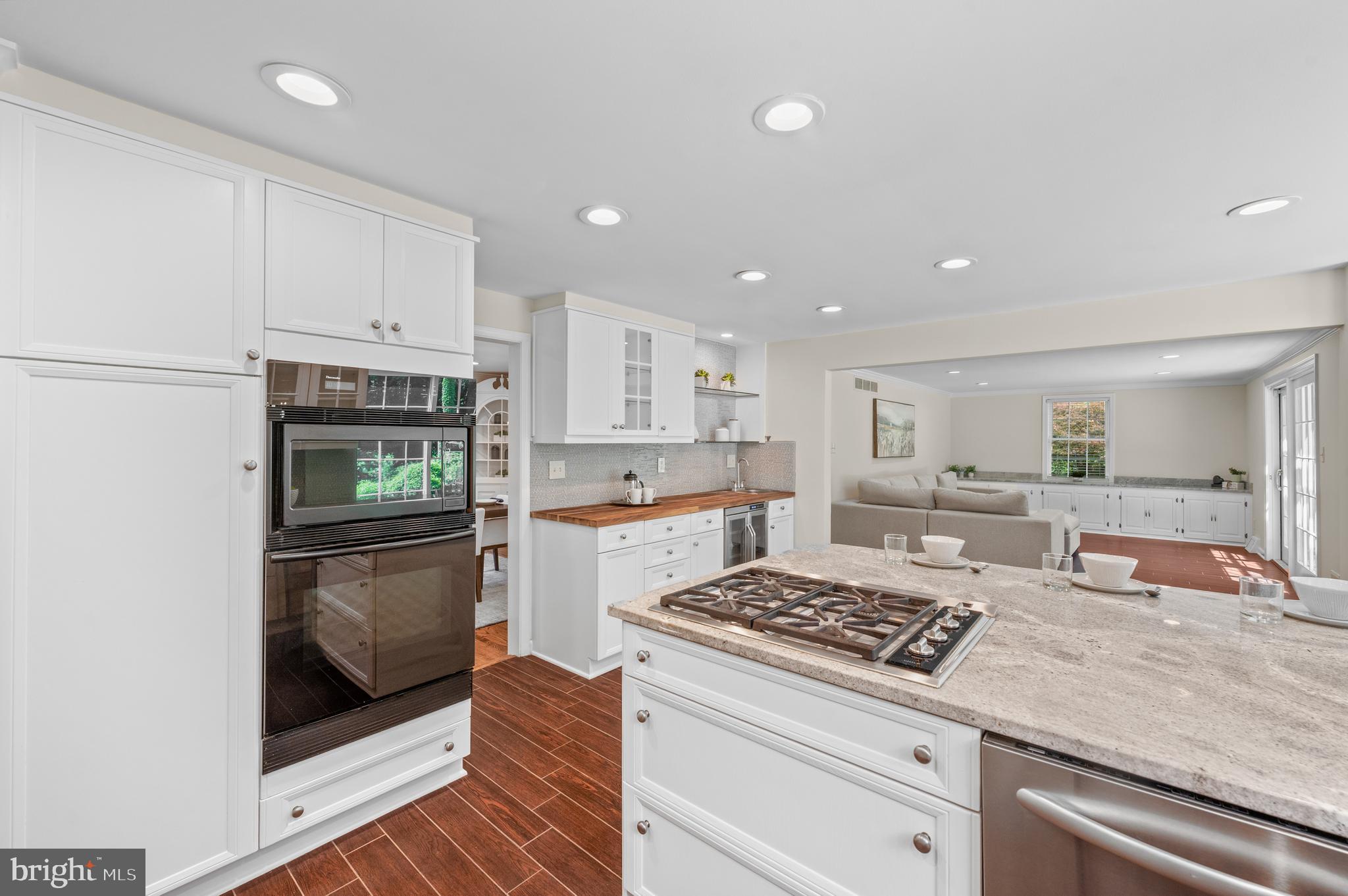 813 Malin Road Newtown Square, PA 19073 - Photo 25 of 55 a kitchen with kitchen island granite countertop a sink cabinets and stainless steel appliances
