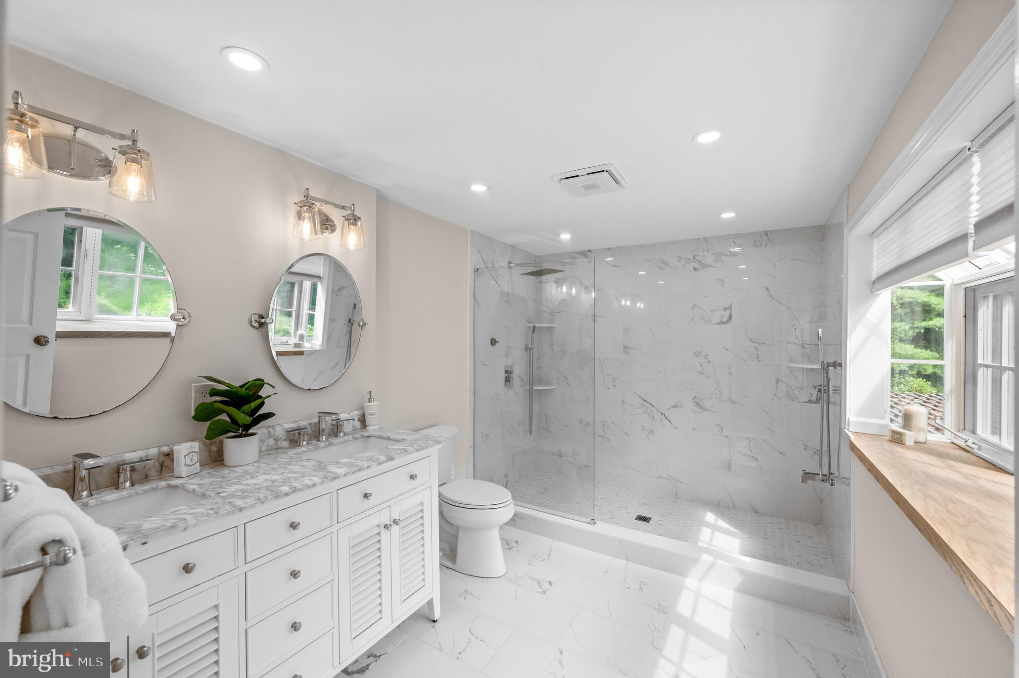 813 Malin Road Newtown Square, PA 19073 - Photo 37 of 55 a bathroom with a double vanity sink toilet and shower