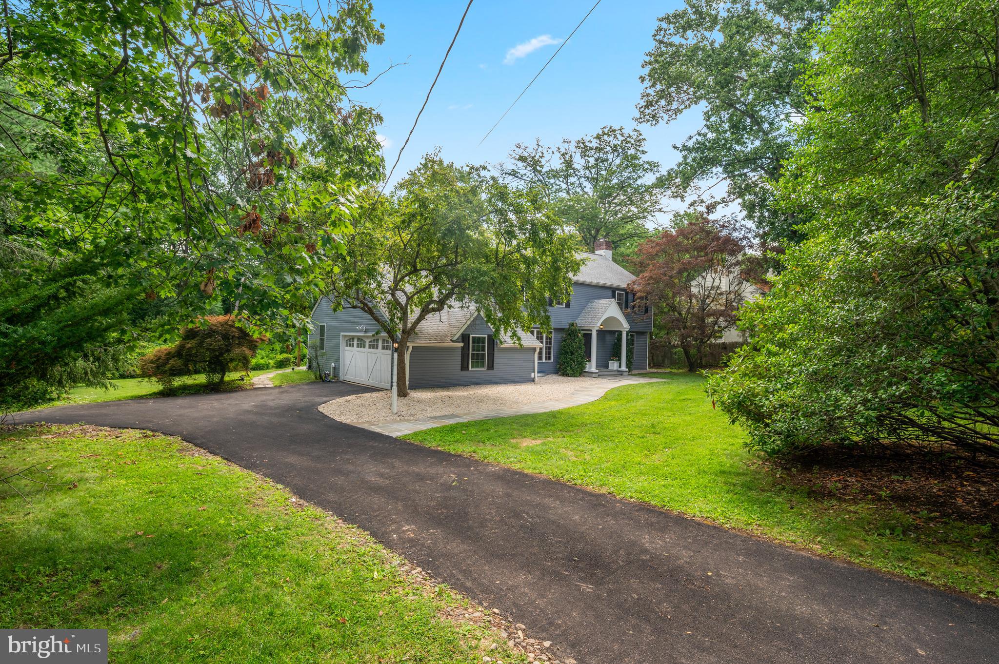 813 Malin Road Newtown Square, PA 19073 - Photo 4 of 55 a front view of a house with a yard and a tree