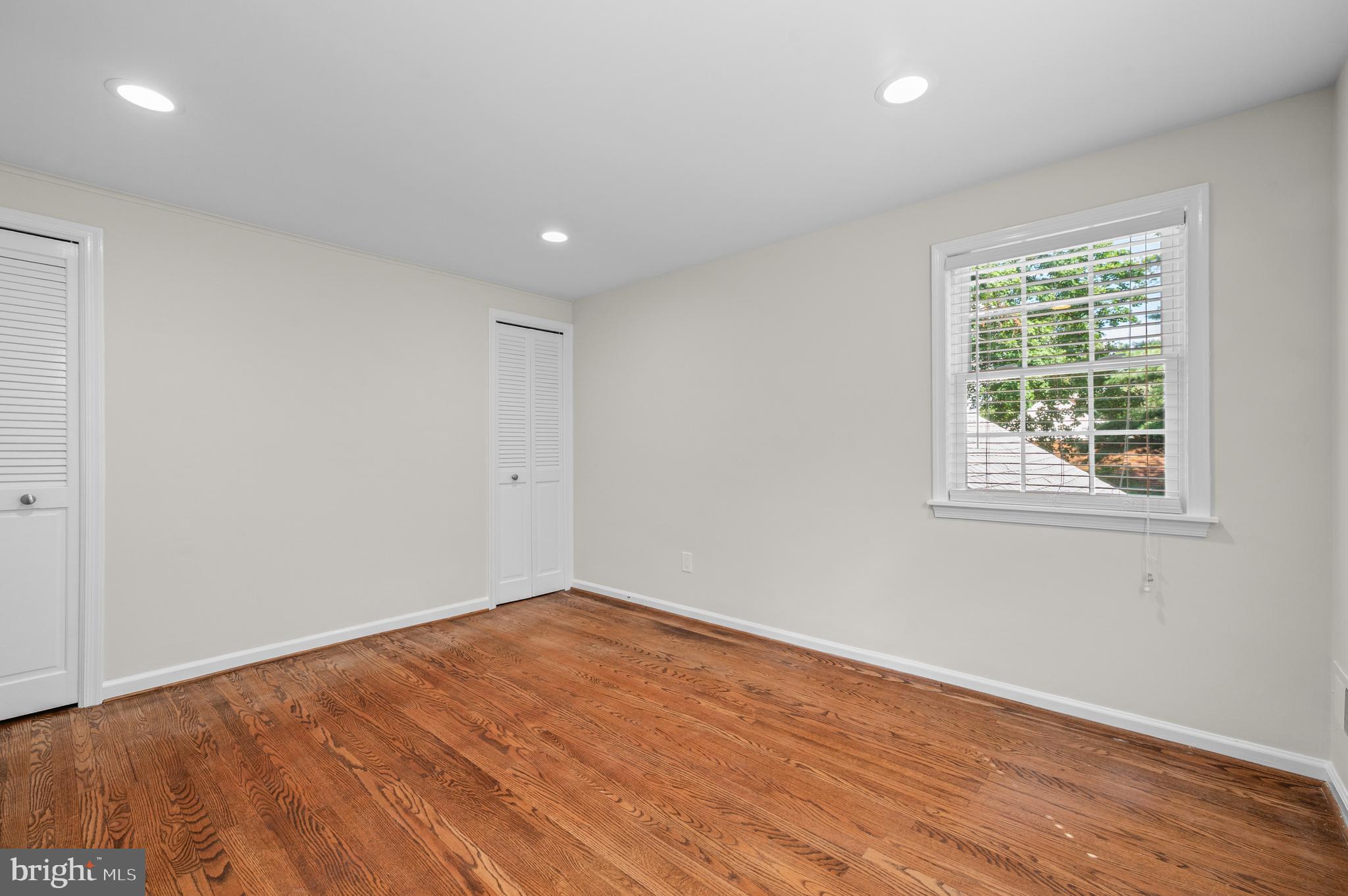 813 Malin Road Newtown Square, PA 19073 - Photo 45 of 55 a view of empty room with wooden floor and fan