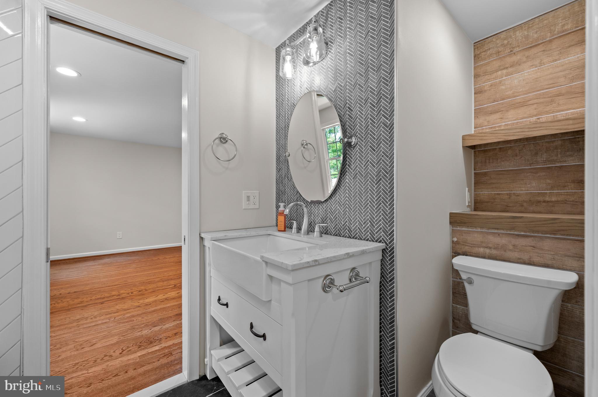 813 Malin Road Newtown Square, PA 19073 - Photo 46 of 55 a bathroom with a toilet a sink and mirror