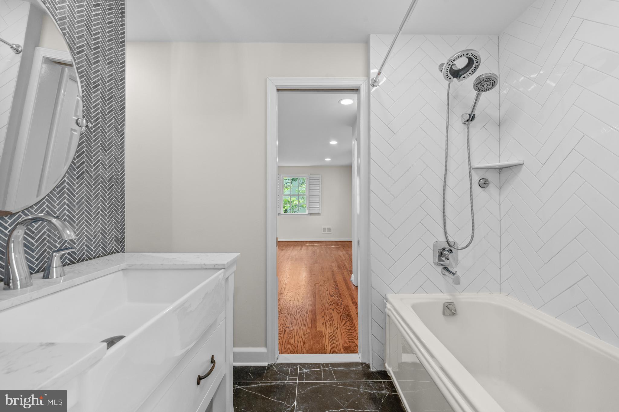 813 Malin Road Newtown Square, PA 19073 - Photo 47 of 55 a bathroom with a tub sink and mirror