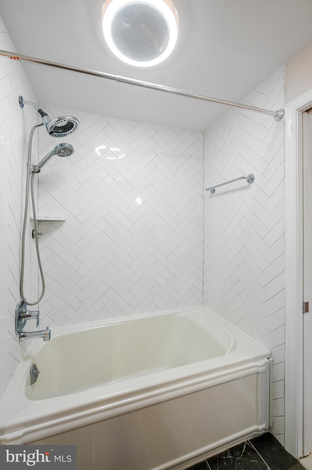 813 Malin Road Newtown Square, PA 19073 - Photo 48 of 55 a bathroom with a bath tub with a shower