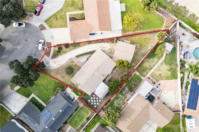 a bedroom with a bed and a mirror on dresser