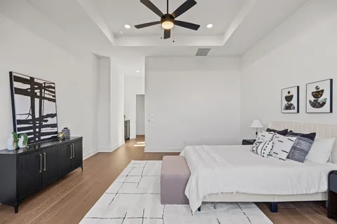 a bedroom with a bed and dresser