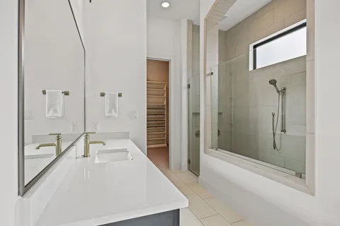 a bathroom with a tub and shower