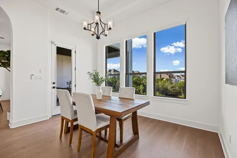 a view of a dining room with furniture window and outside view