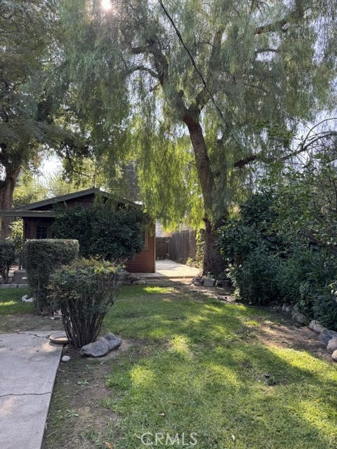 4482 4th Street Riverside, CA 92501 - Photo 2 of 7 a front view of a house with garden