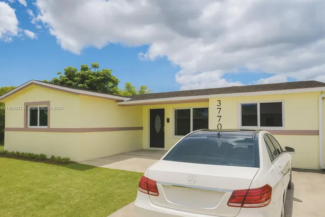 a front view of a house with yard