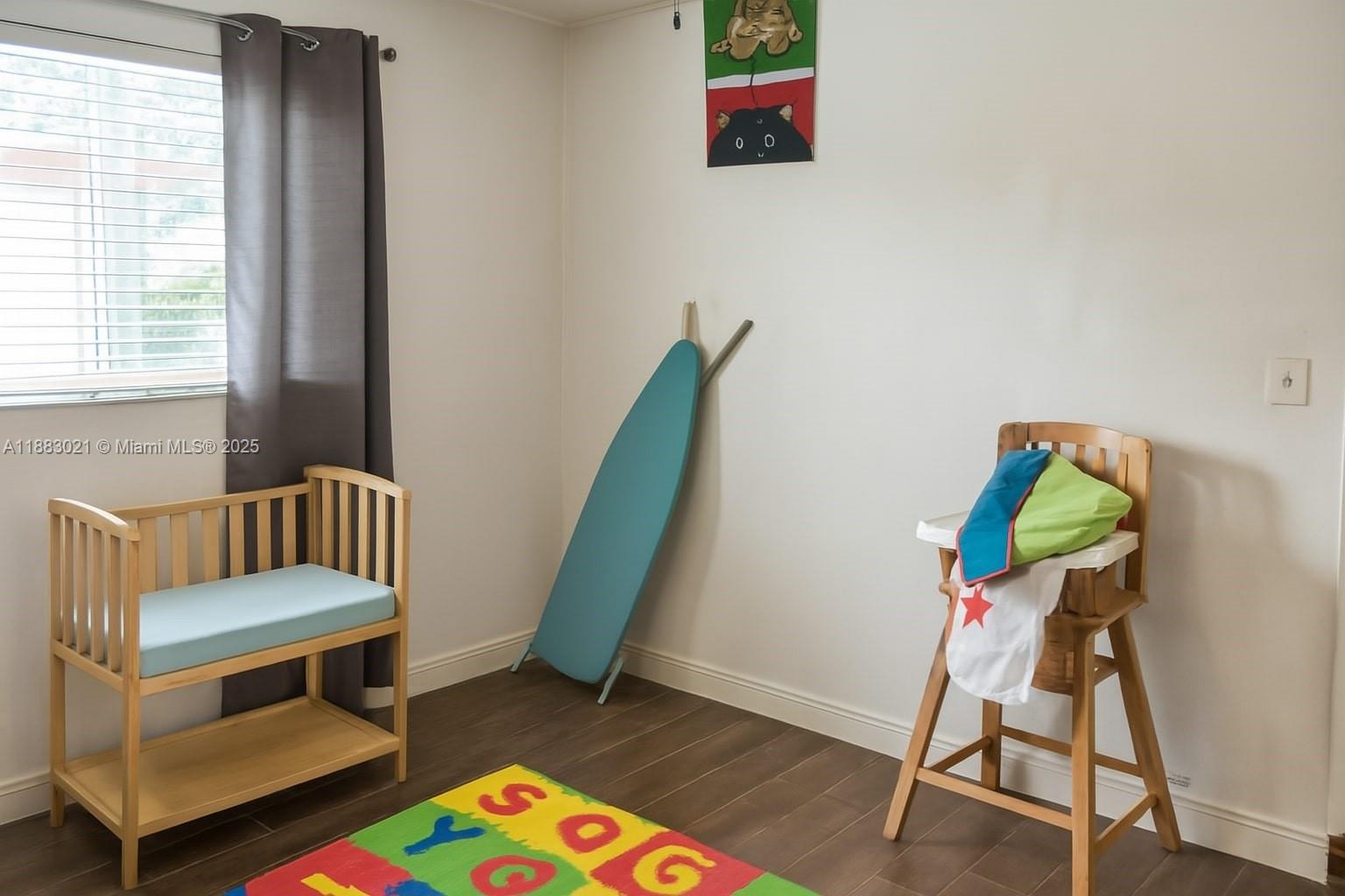 3770 Northwest 8th Place Lauderhill, FL 33311 - Photo 11 of 31 a living room with furniture and a wooden floor