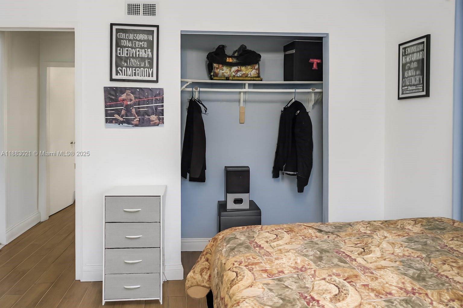 3770 Northwest 8th Place Lauderhill, FL 33311 - Photo 13 of 31 a bedroom with a bed and wooden floor