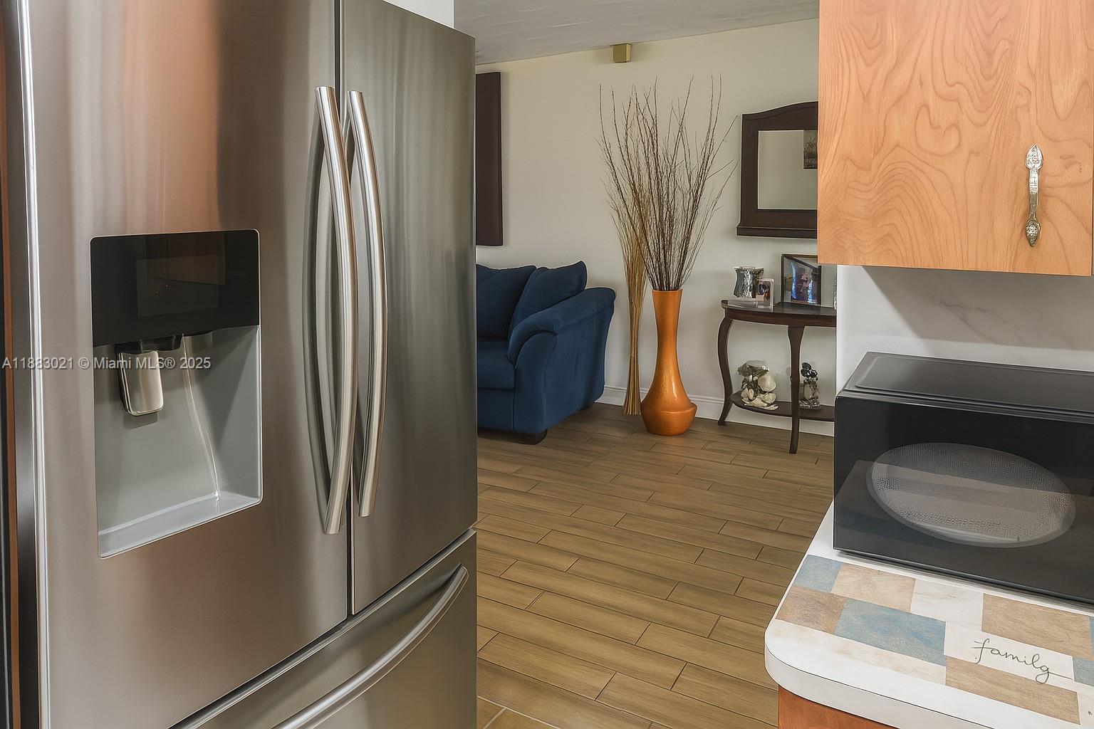 3770 Northwest 8th Place Lauderhill, FL 33311 - Photo 14 of 31 a kitchen with stainless steel appliances granite countertop a refrigerator and a sink