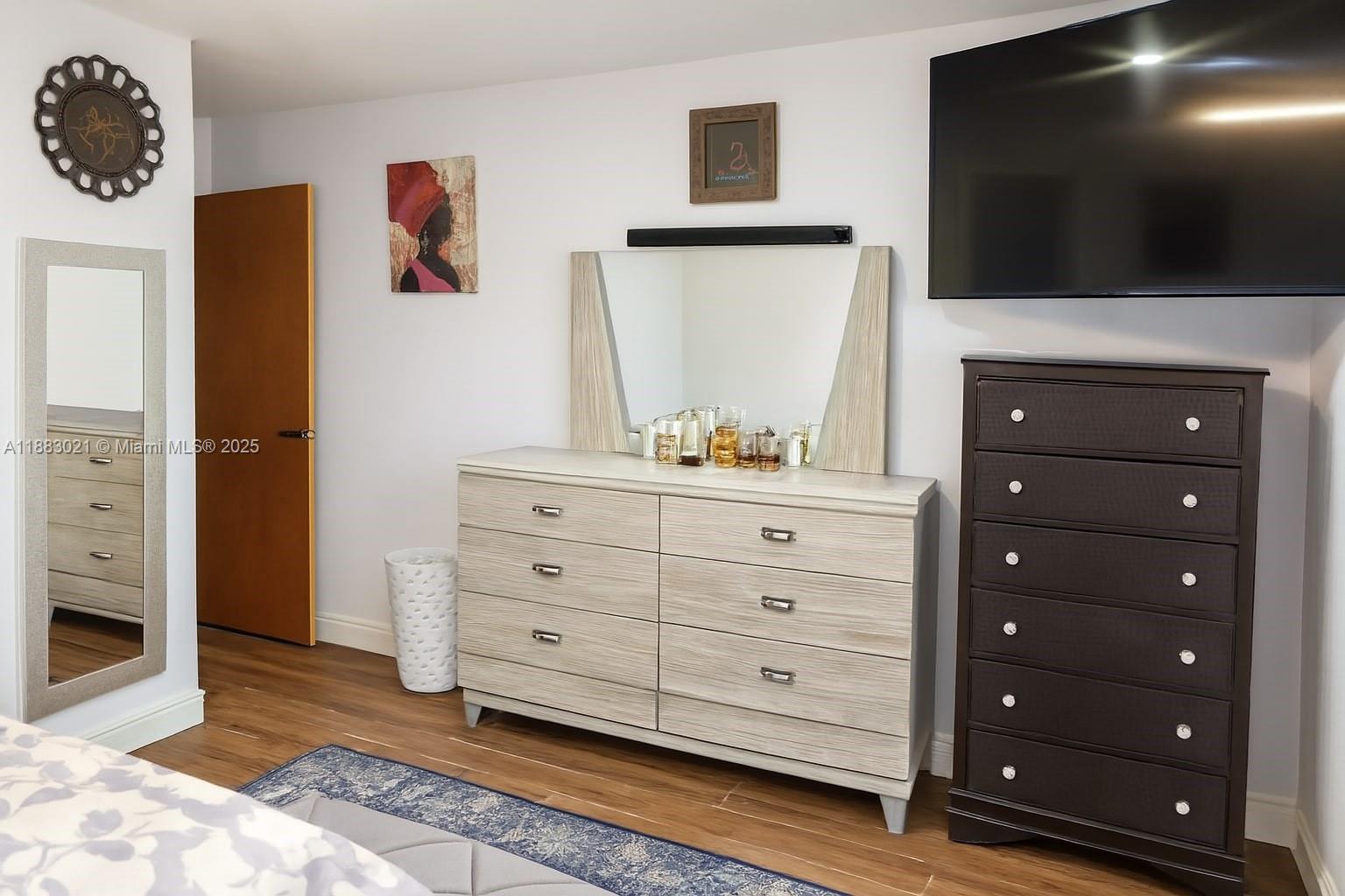 3770 Northwest 8th Place Lauderhill, FL 33311 - Photo 19 of 31 a room with a cabinets and a flat screen tv