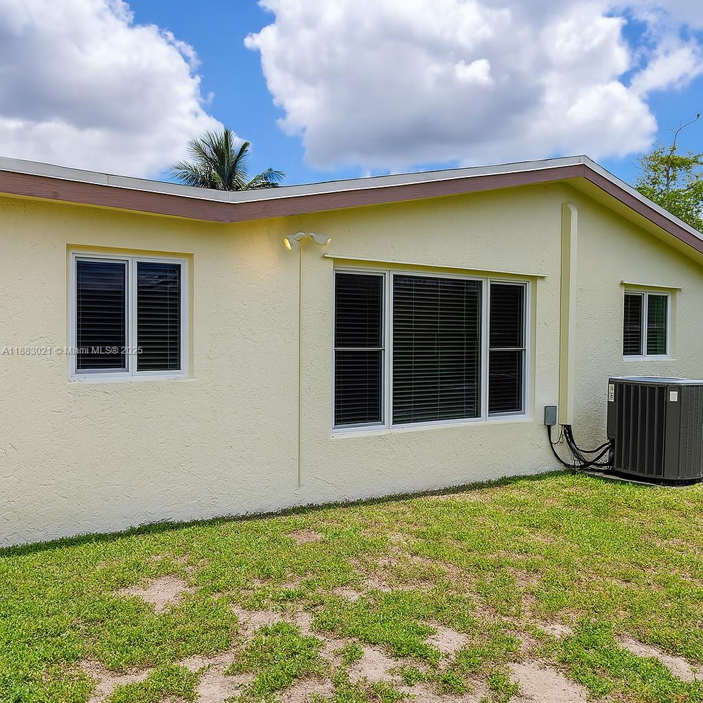 3770 Northwest 8th Place Lauderhill, FL 33311 - Photo 20 of 31 a front view of a house with a garden