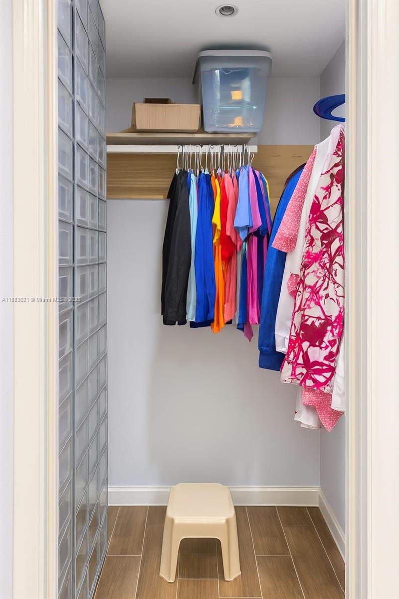 3770 Northwest 8th Place Lauderhill, FL 33311 - Photo 23 of 31 a view of walk in closet with clothes and shoes