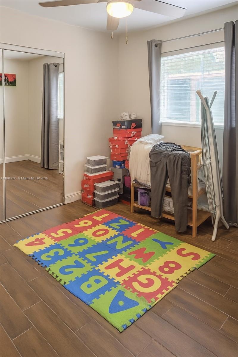 3770 Northwest 8th Place Lauderhill, FL 33311 - Photo 25 of 31 a bedroom with a bed and a table in it
