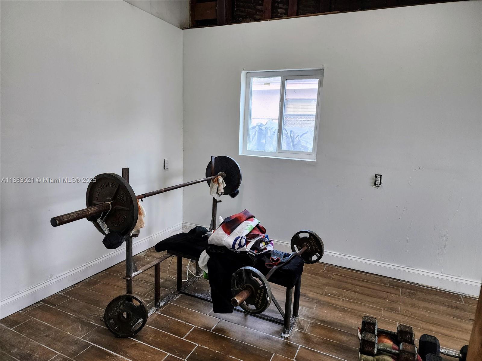 3770 Northwest 8th Place Lauderhill, FL 33311 - Photo 29 of 31 a living room with furniture and a window