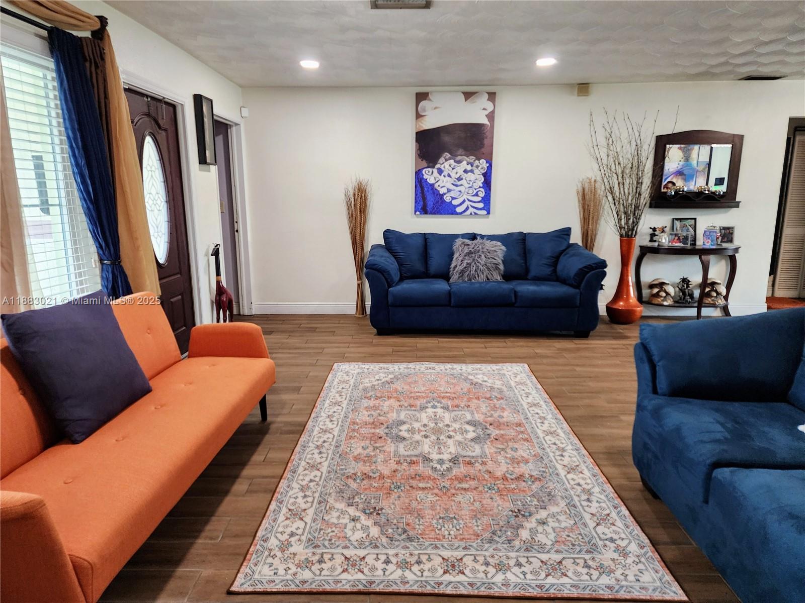 3770 Northwest 8th Place Lauderhill, FL 33311 - Photo 3 of 31 a living room with furniture and a rug