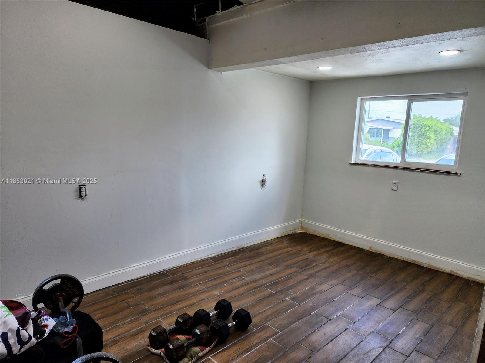 3770 Northwest 8th Place Lauderhill, FL 33311 - Photo 31 of 31 a view of a room with wooden floor and window