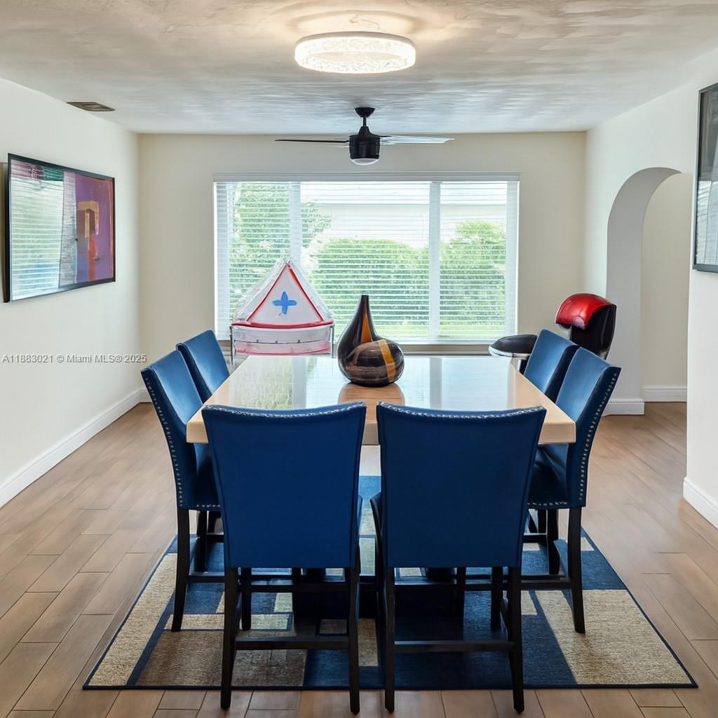 3770 Northwest 8th Place Lauderhill, FL 33311 - Photo 6 of 31 a view of a dining room with furniture window and outside view