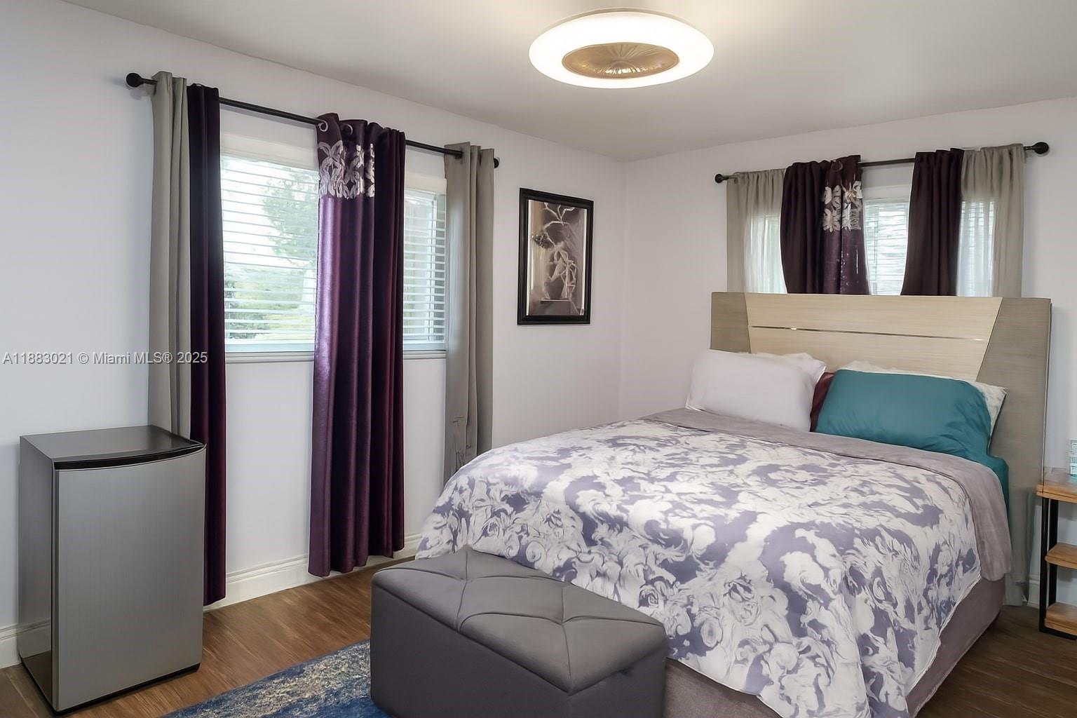 3770 Northwest 8th Place Lauderhill, FL 33311 - Photo 7 of 31 a bedroom with a bed and a window