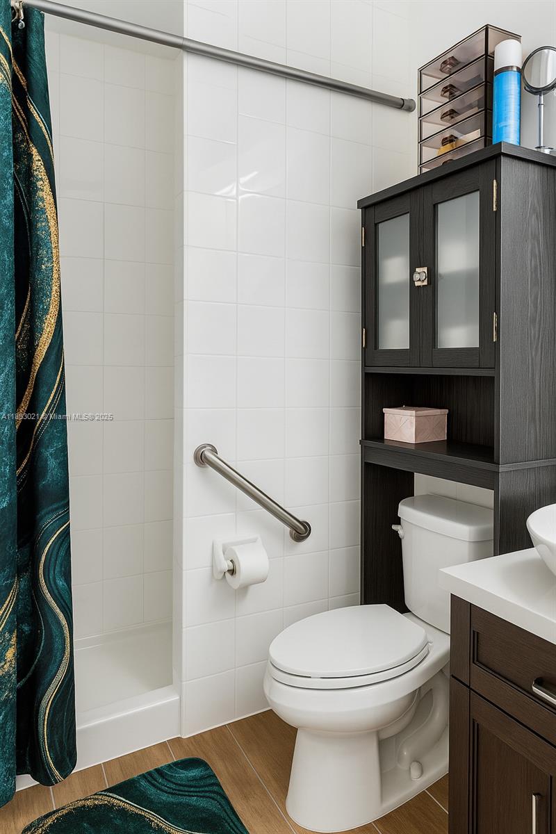 3770 Northwest 8th Place Lauderhill, FL 33311 - Photo 8 of 31 a bathroom with a toilet and a shower