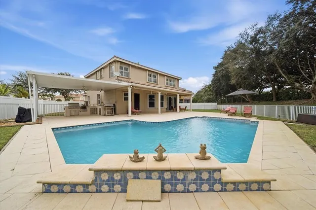 a view of a house with a swimming pool