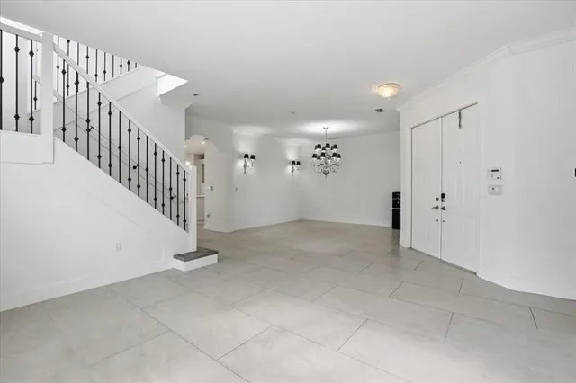 a view of an empty room with stairs