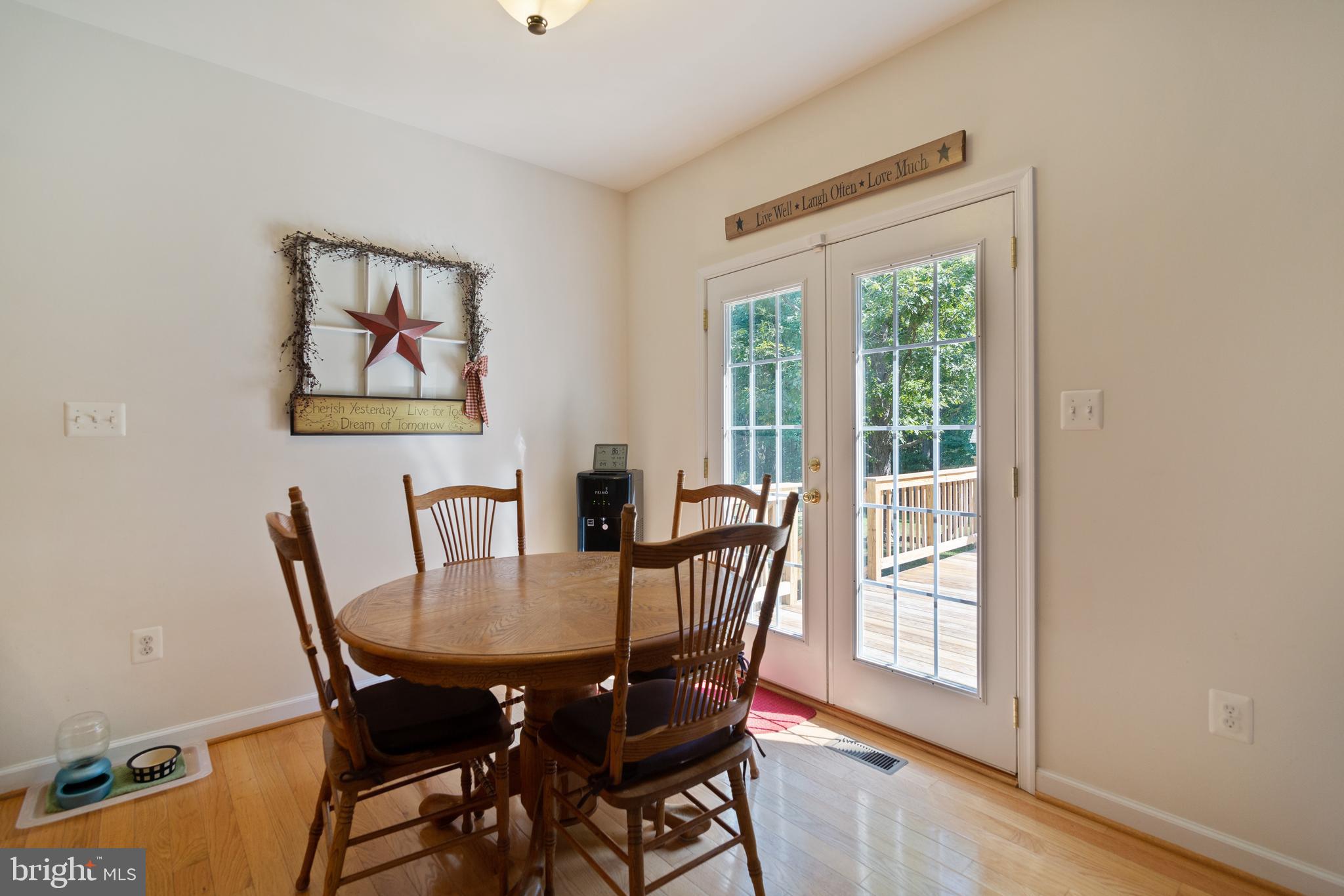 8289 Swan Woods Road Rhoadesville, VA 22542 - Photo 12 of 32 Dining area with glass patio door to rear deck