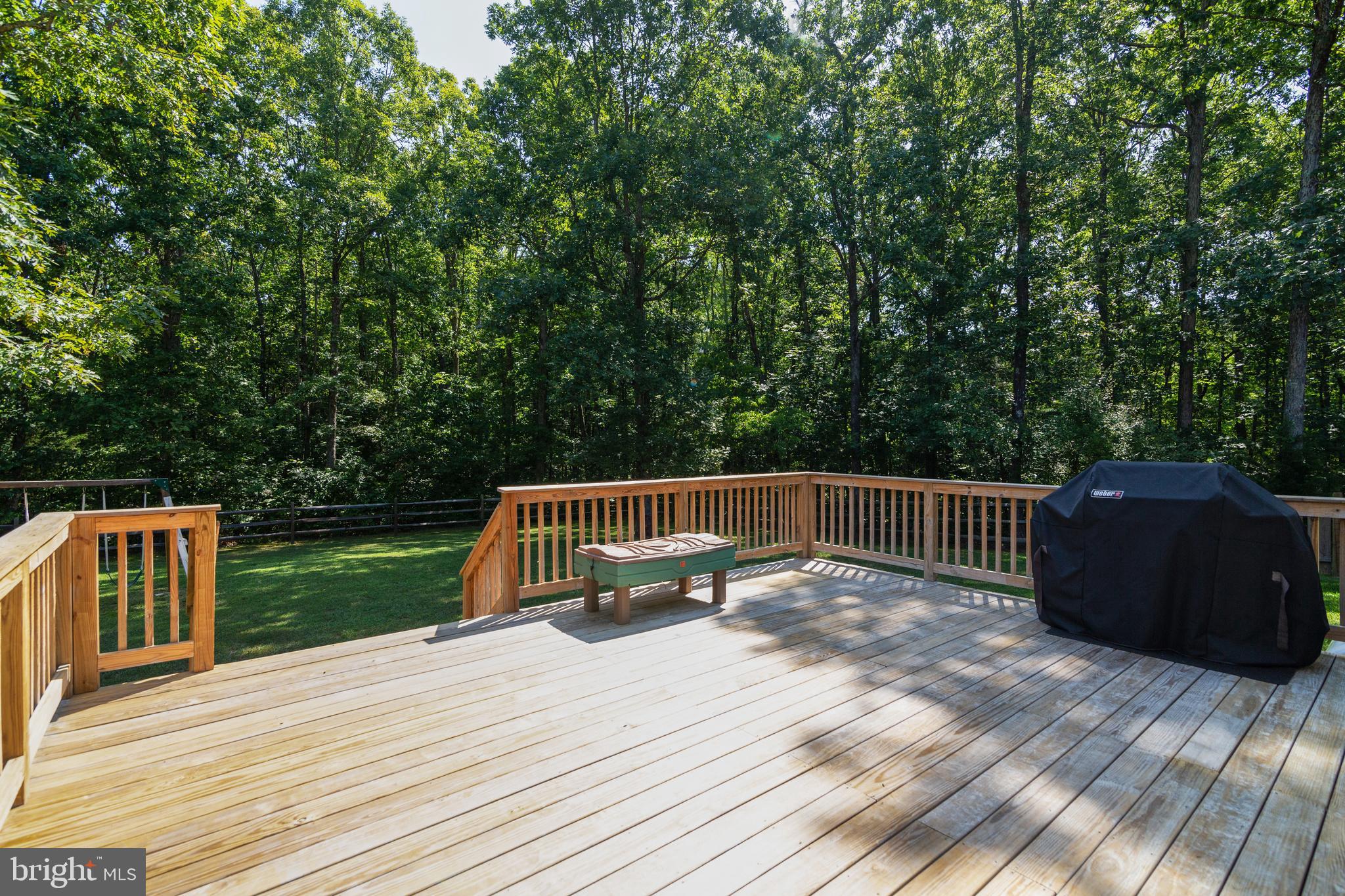 8289 Swan Woods Road Rhoadesville, VA 22542 - Photo 13 of 32 Gorgeous large rear deck perfect for entertaining