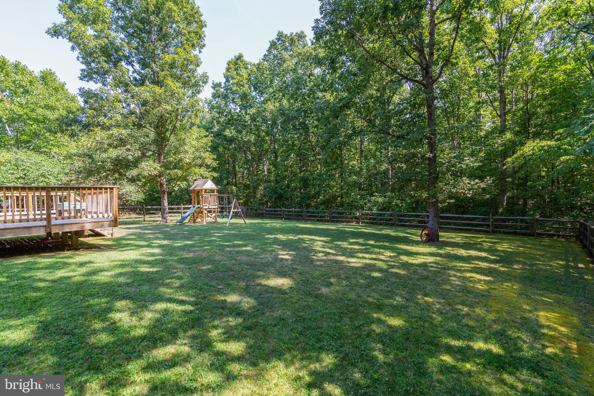 8289 Swan Woods Road Rhoadesville, VA 22542 - Photo 27 of 32 Beautiful large fenced back yard with mature trees