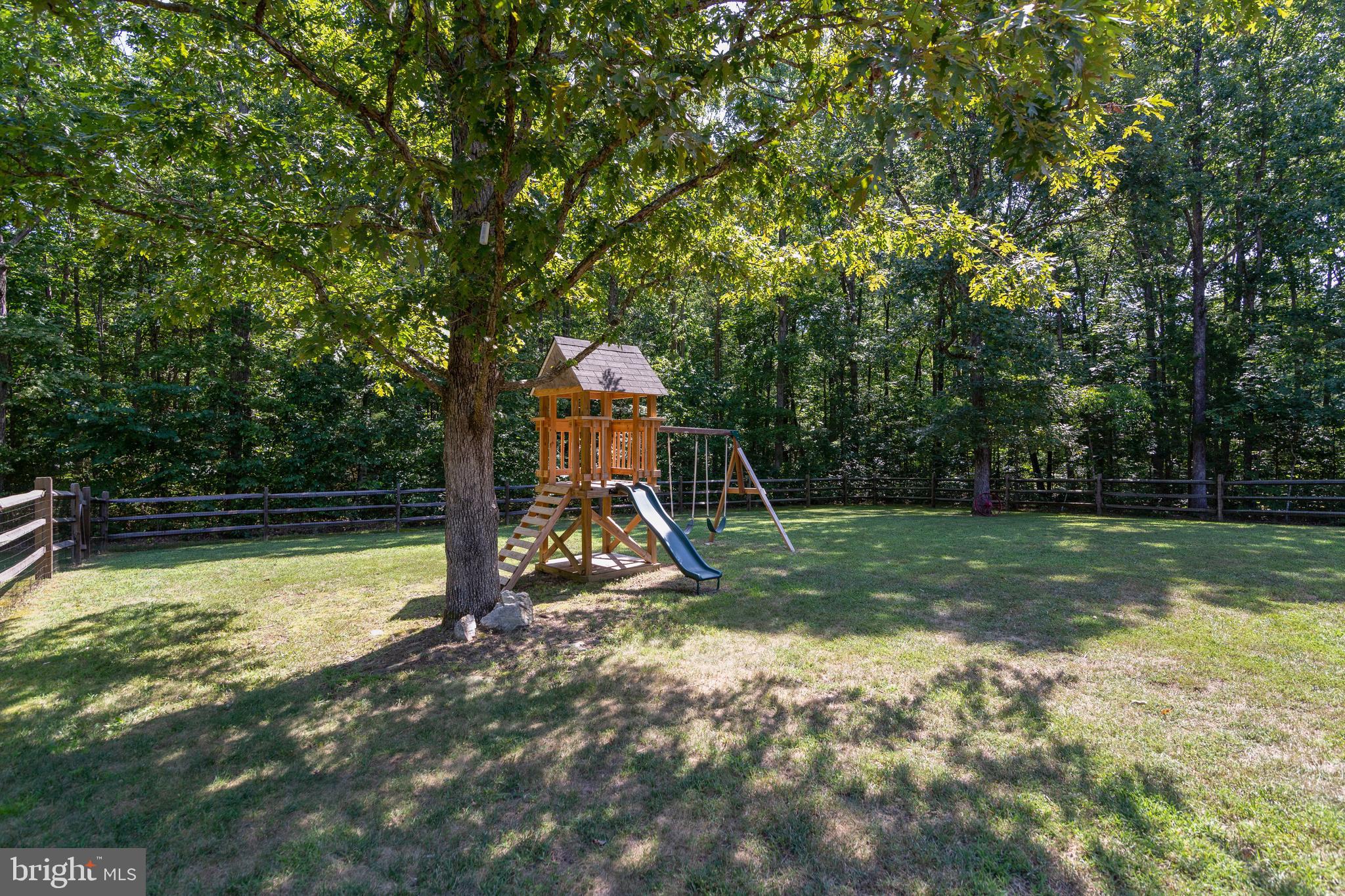 8289 Swan Woods Road Rhoadesville, VA 22542 - Photo 28 of 32 Beautiful large fenced back yard with mature trees