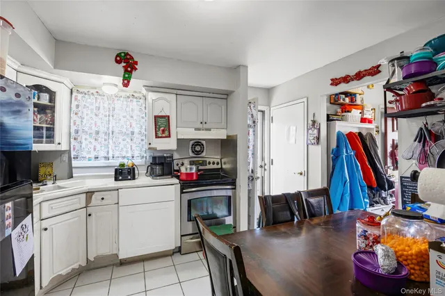 a view of a dining room with furniture and a window