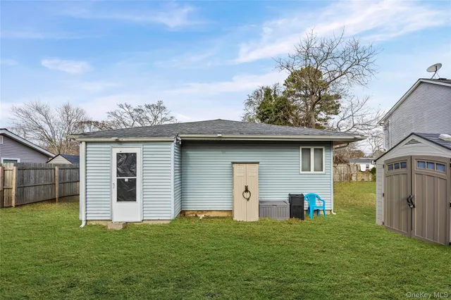 a front view of a house with a garden and yard