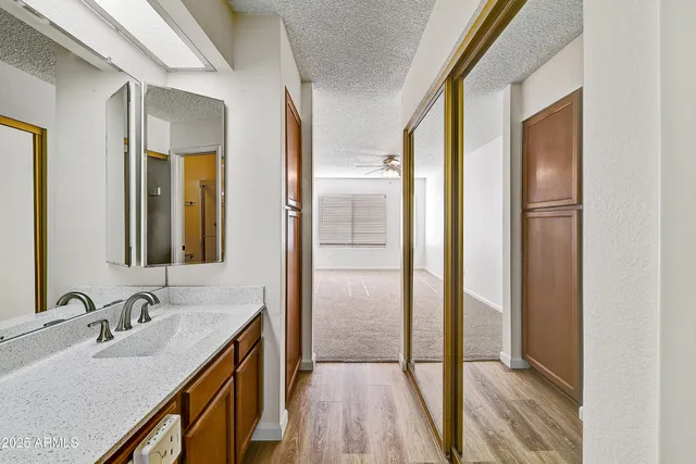 a bathroom with a double vanity sink and mirror