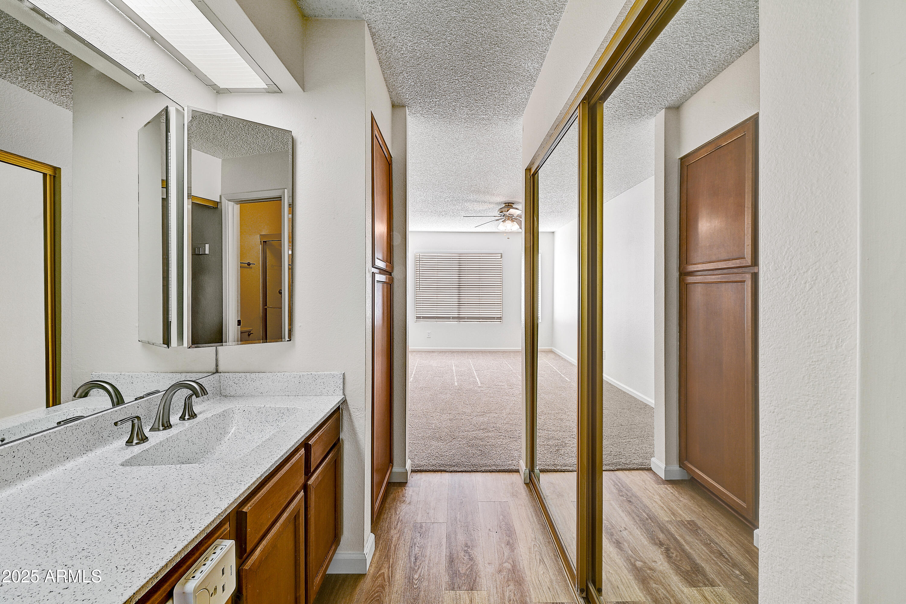 925 North College Avenue, Unit E217 Tempe, AZ 85288 - Photo 22 of 32 a bathroom with a double vanity sink and mirror