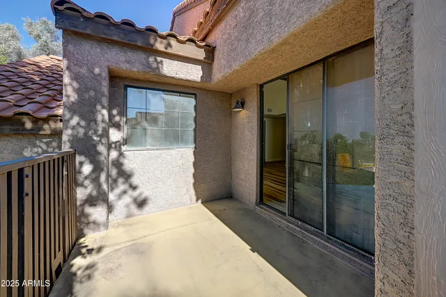 a bathroom with a glass door shower and sink