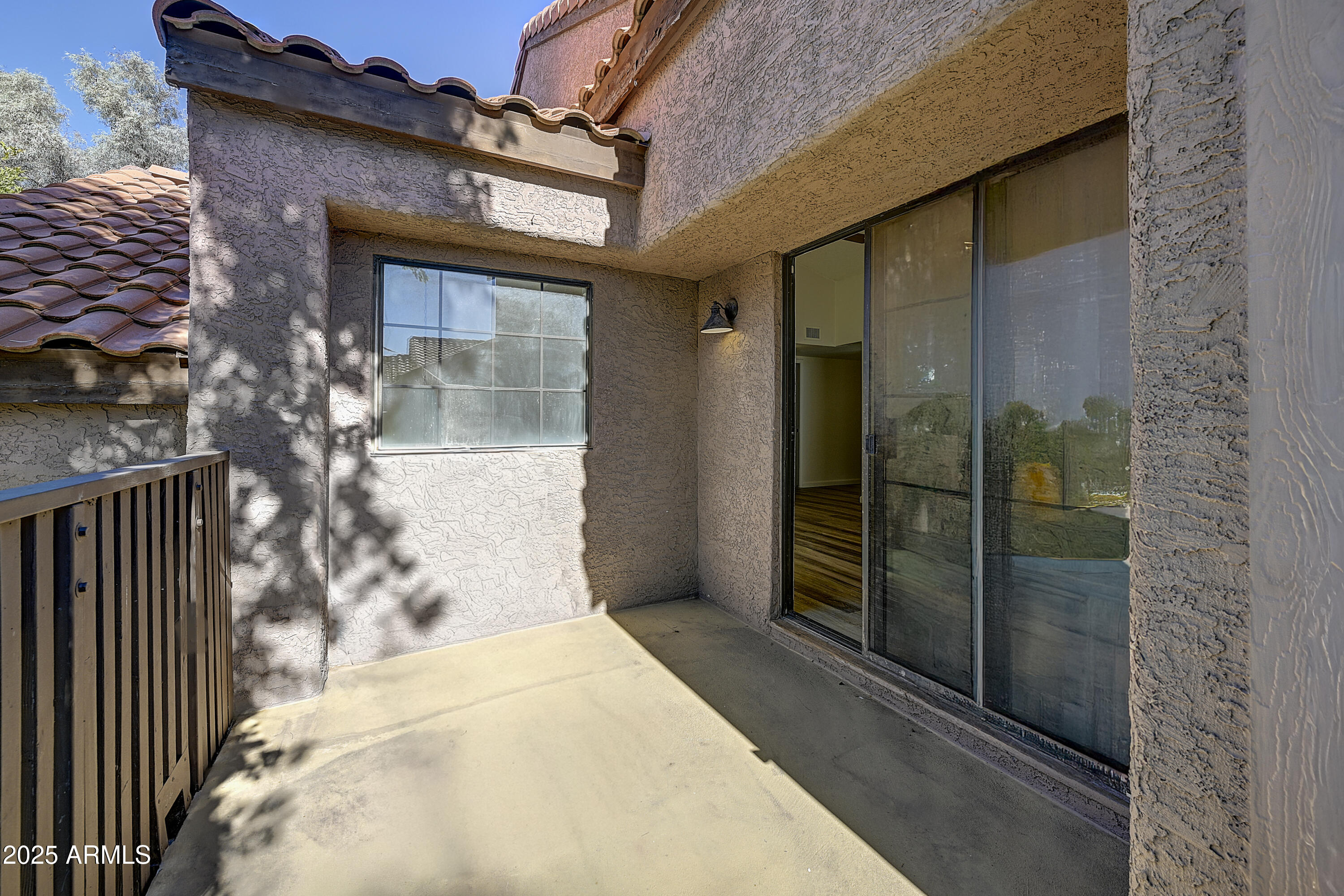 925 North College Avenue, Unit E217 Tempe, AZ 85288 - Photo 25 of 32 a bathroom with a glass door shower and sink