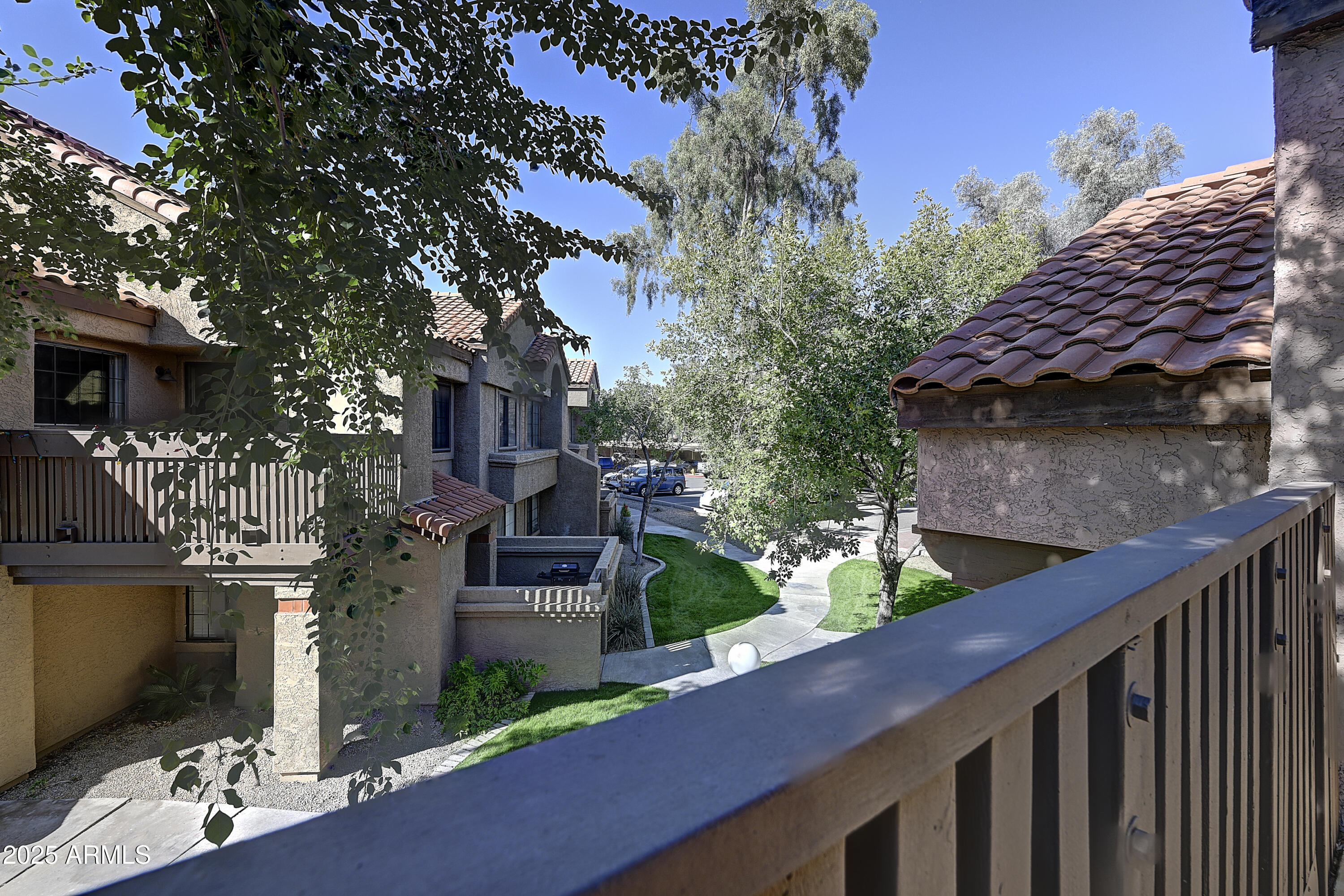 925 North College Avenue, Unit E217 Tempe, AZ 85288 - Photo 26 of 32 a view of house with wooden fencing