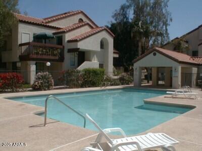 925 North College Avenue, Unit E217 Tempe, AZ 85288 - Photo 27 of 32 a front view of a house with garden