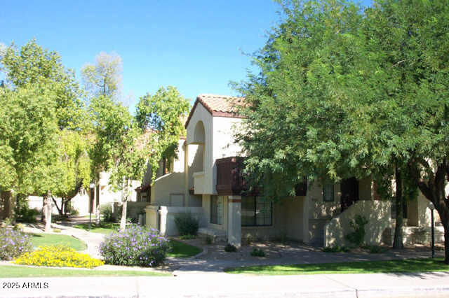 925 North College Avenue, Unit E217 Tempe, AZ 85288 - Photo 28 of 32 front view of house with a tree