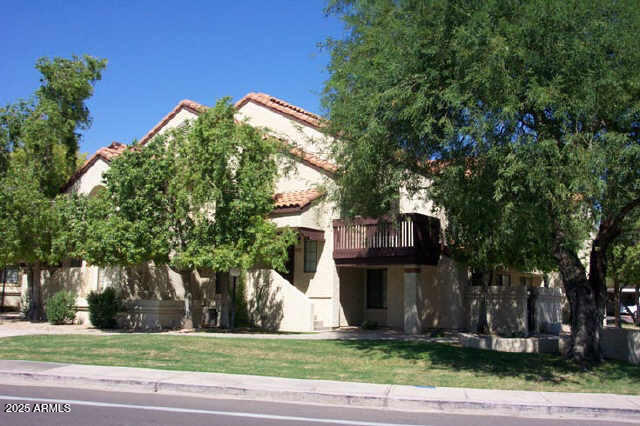925 North College Avenue, Unit E217 Tempe, AZ 85288 - Photo 29 of 32 a view of a house with a yard