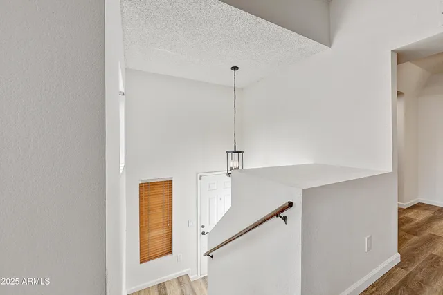 a view of an entryway with wooden floor