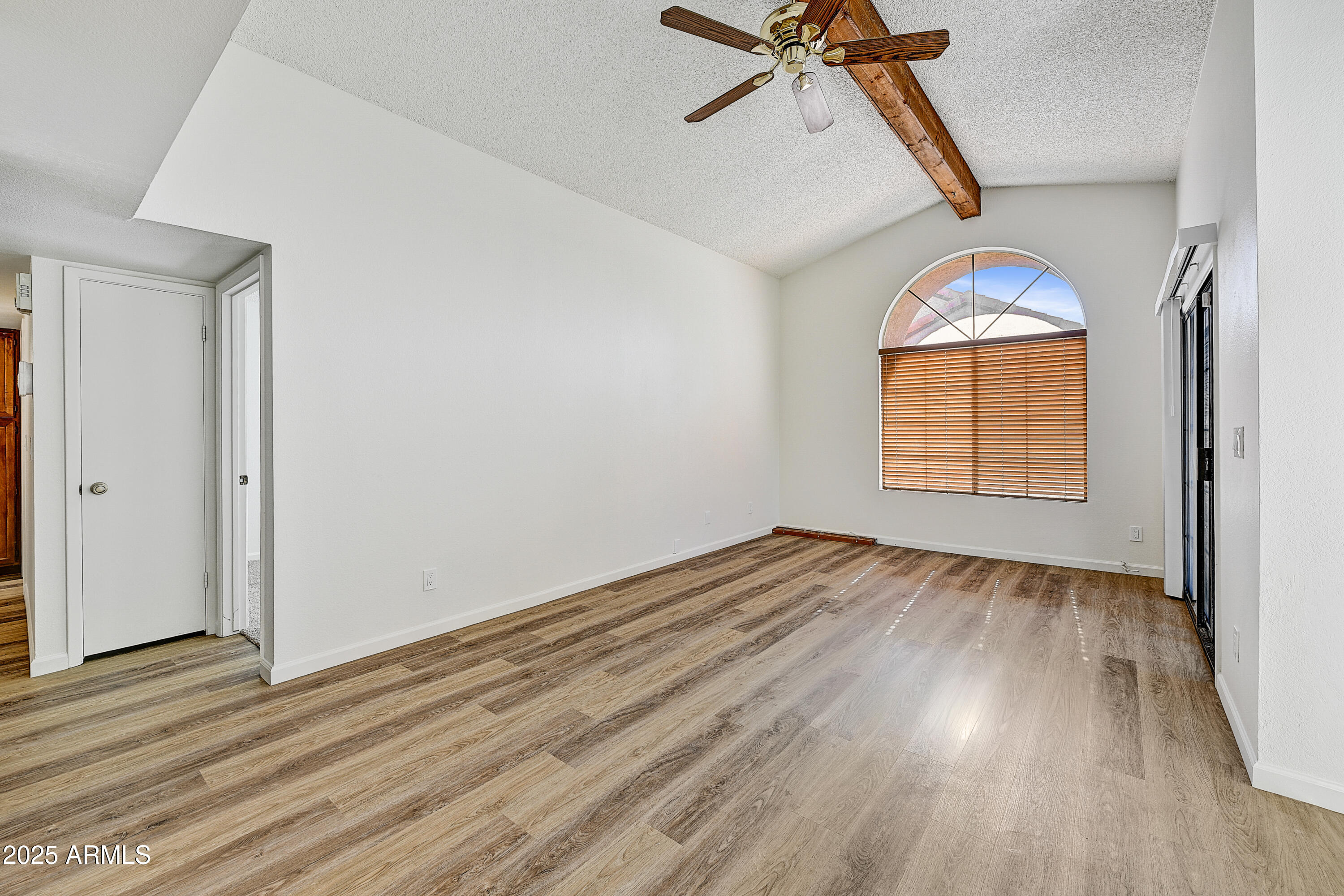 925 North College Avenue, Unit E217 Tempe, AZ 85288 - Photo 7 of 32 wooden floor in an empty room with a window