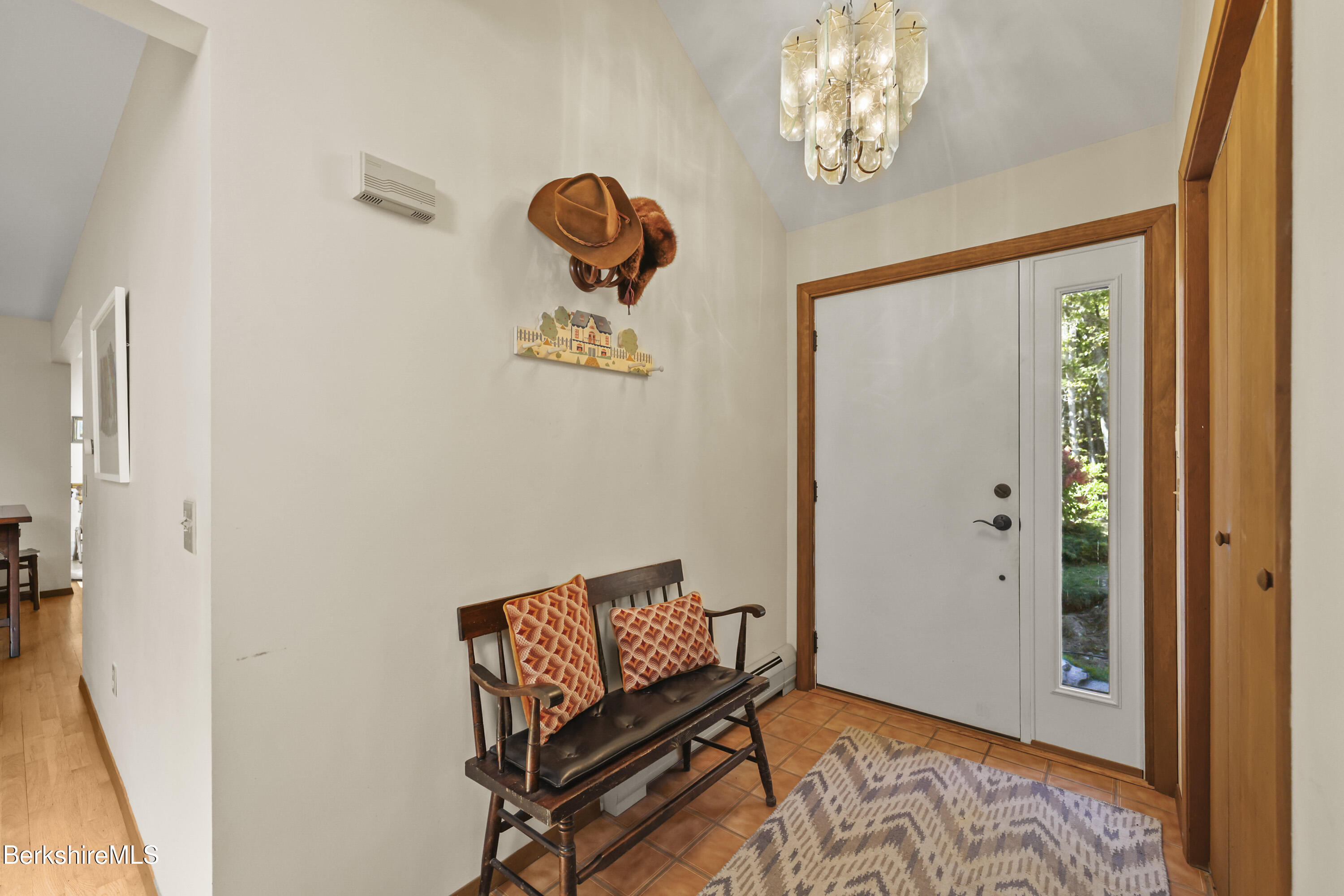 337 Captain Whitney Road Becket, MA 01223 - Photo 11 of 53 a view of a hallway with entryway wooden floor and front door
