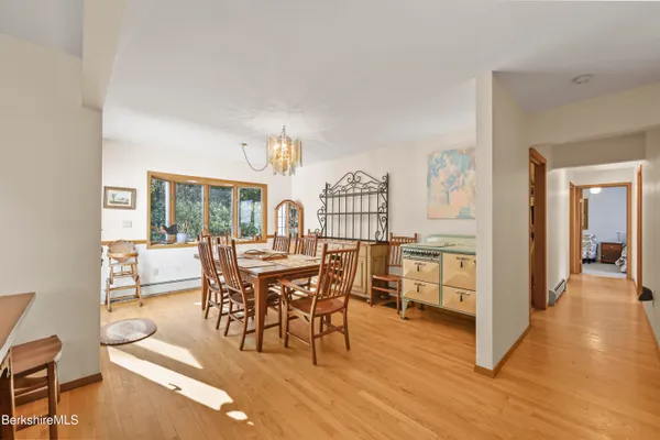 a view of a dining room with furniture and wooden floor
