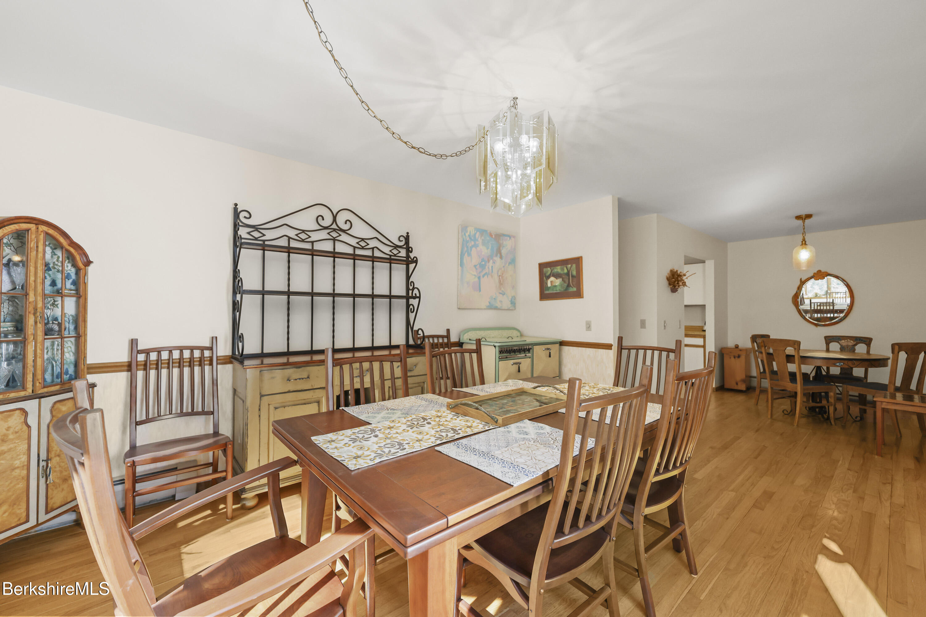 337 Captain Whitney Road Becket, MA 01223 - Photo 14 of 53 a view of a dining room with furniture window and wooden floor